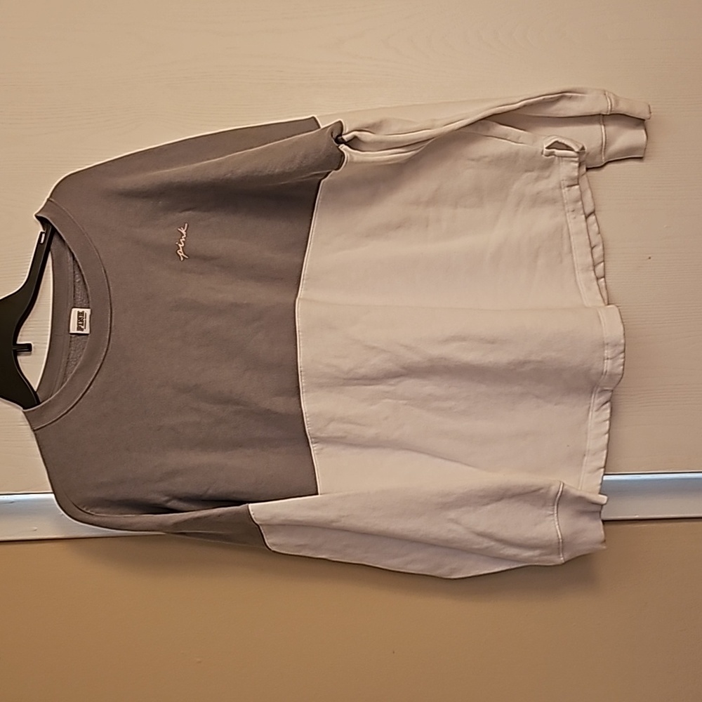 Pink sweatshirt whit and gray with pink written on the back as seen in pic.